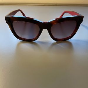 Valentino sunglasses with signature studs at the temples.